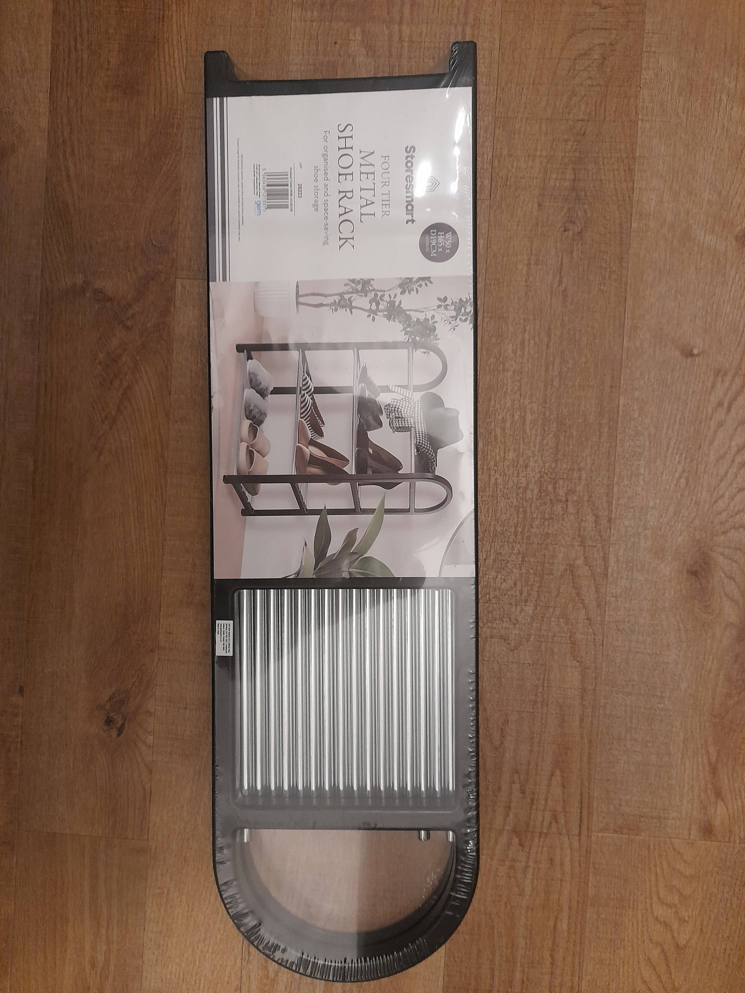 4 Tier Shoe Rack Colour will vary (between grey or black).